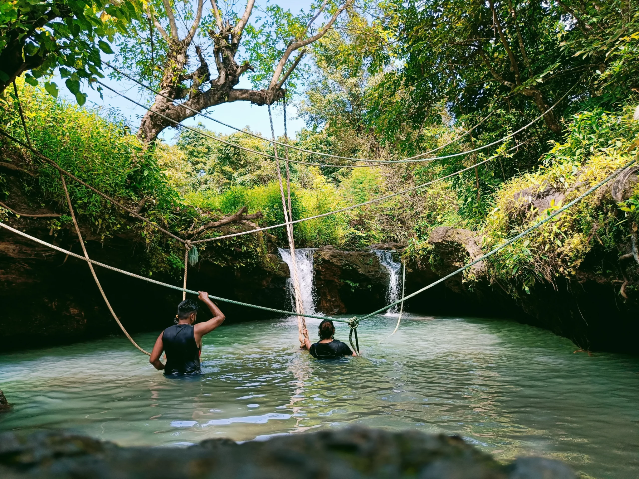 Goa cave pool with waterfall